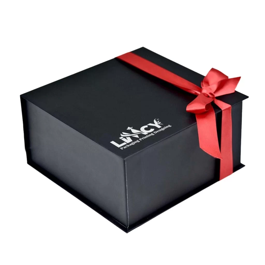 A black gift box tied with a red ribbon, set against a clean white background.