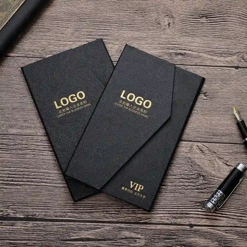 Two black business cards featuring elegant gold foil logos, showcasing a professional and sophisticated design.