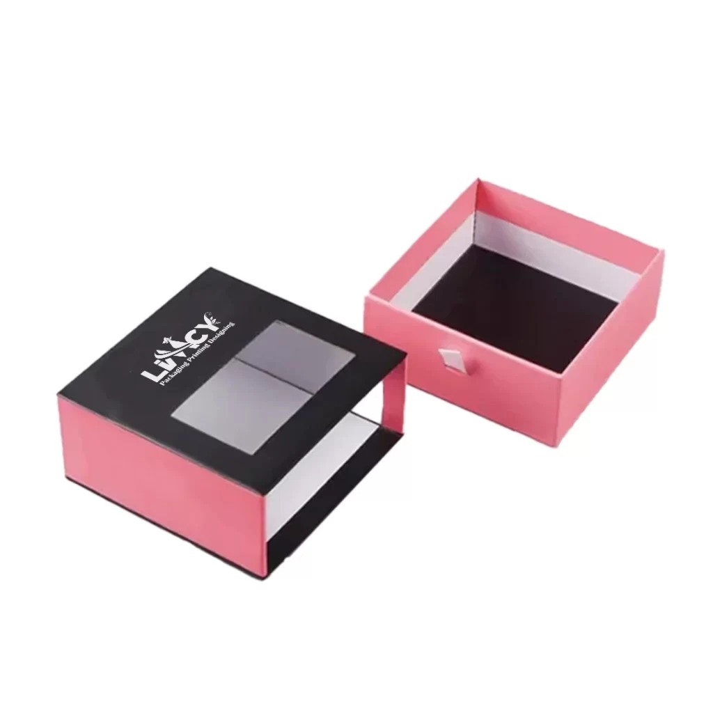 A pink box with a black lid featuring a white logo prominently displayed on the front.