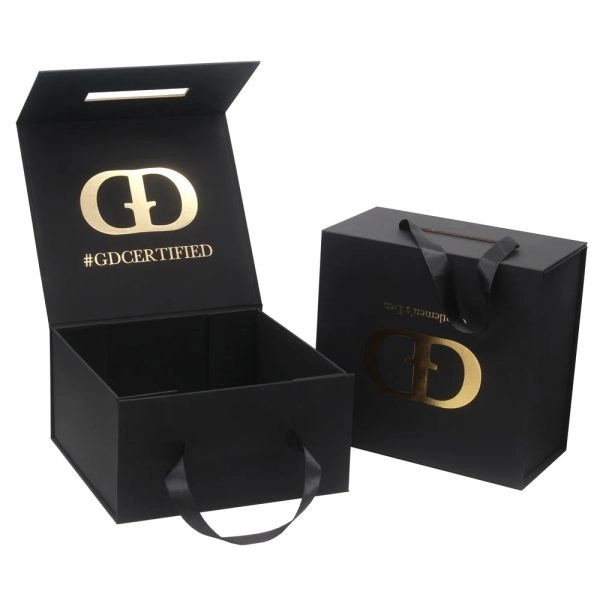Elegant black gift box made of cardboard, adorned with a gold logo.