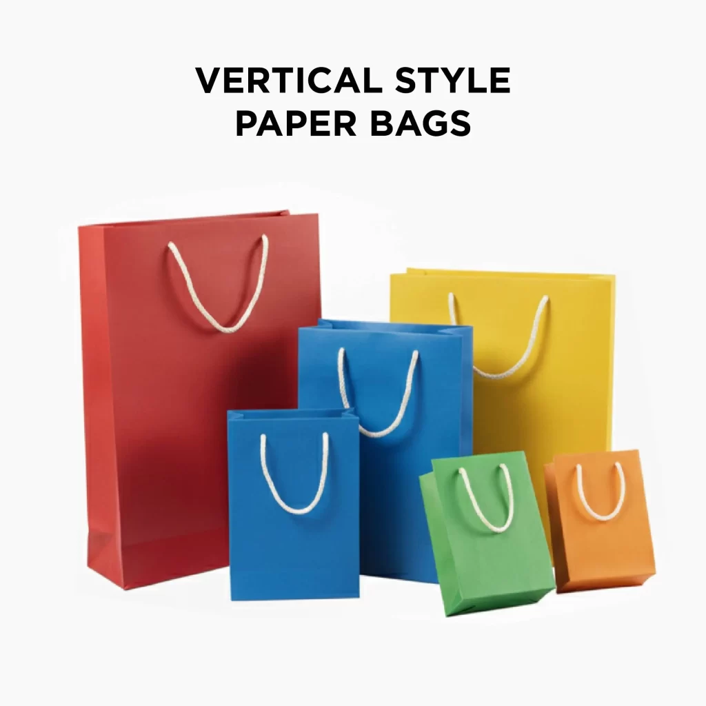 Assorted vertical style paper bags in multiple bright colors with rope handles.