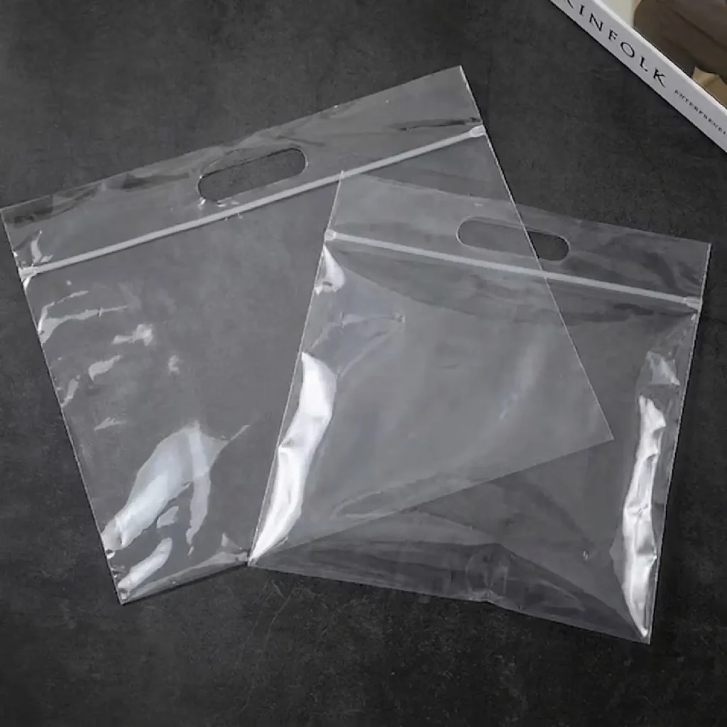 Transparent bags with handle clear plastic packaging for retail and accessories.